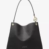 Christina Große Schultertasche mit charakteristischem Logo Christina Große Schultertasche mit charakteristischem Logo