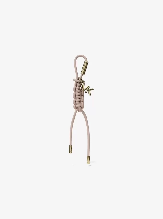 Goldfarbener Taschenanhänger aus geflochtener Kordel Goldfarbener Taschenanhänger aus geflochtener Kordel