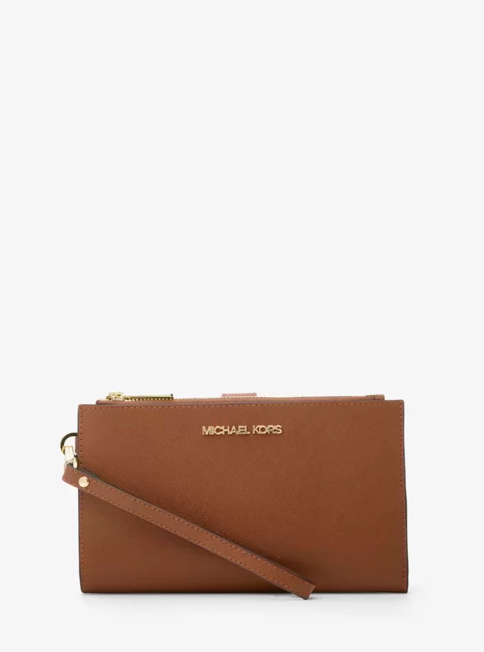 Jet Set Große Smartphone-Handgelenktasche aus Leder Jet Set Große Smartphone-Handgelenktasche aus Leder