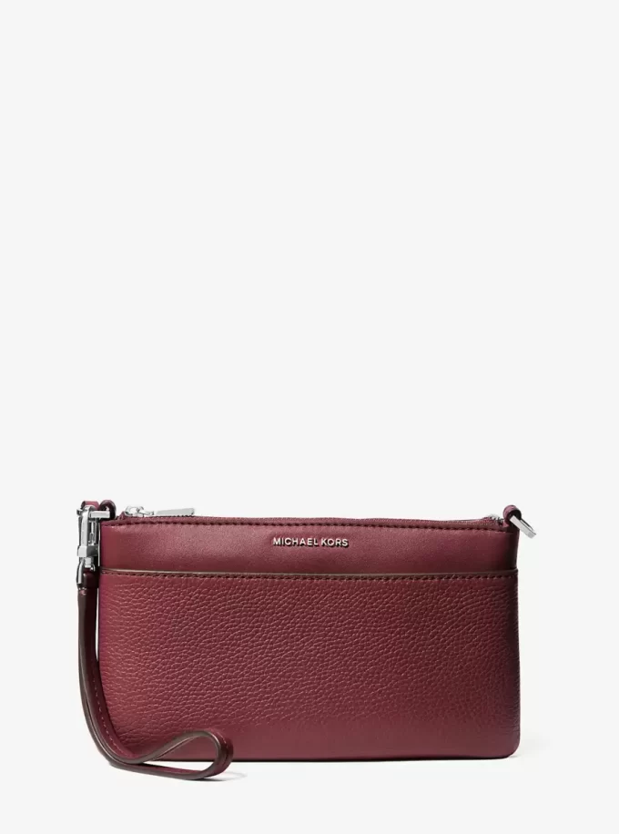 Jet Set Medium genarbtes Leder, wandelbare Handgelenktasche Jet Set Medium genarbtes Leder, wandelbare Handgelenktasche