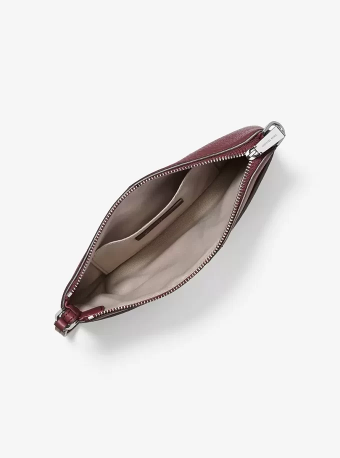 Jet Set Medium genarbtes Leder, wandelbare Handgelenktasche Jet Set Medium genarbtes Leder, wandelbare Handgelenktasche