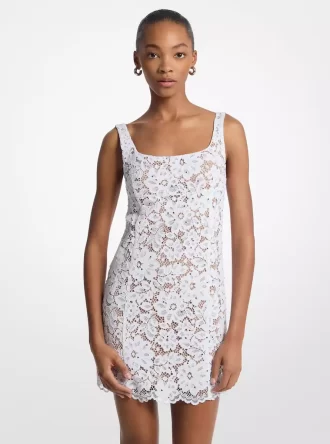 Minikleid aus mit Nieten, Kordel und floraler Spitze