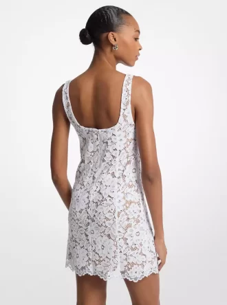 Minikleid aus mit Nieten, Kordel und floraler Spitze